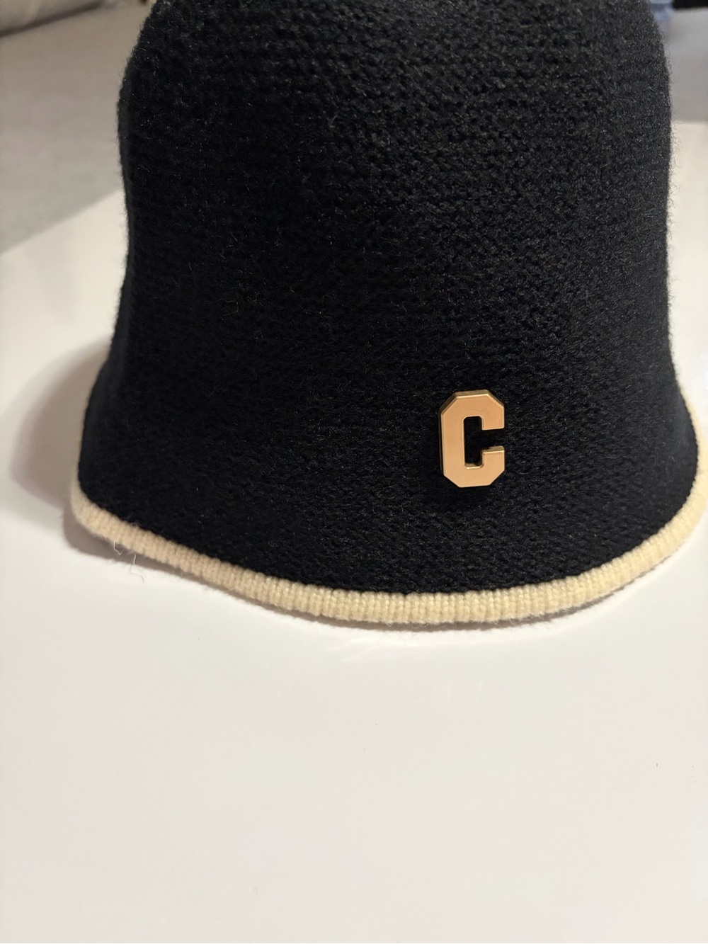 Black Knit Bucket Hat with Cream Trim and Gold 'C' Accent
